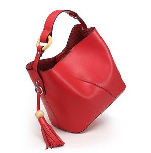 Tasarımcı-yeni inek derisi bayan çanta kova çantası, bir omuz ile basit püskül bayan çanta