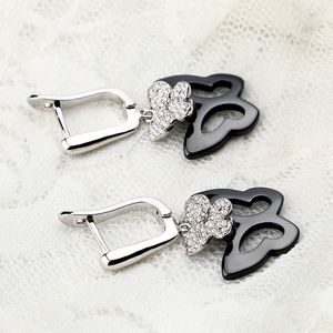 Fashion-g Schmetterlings-Ohrringe mit Bling-Kristall, schwarz-weiße Keramik, modisches Temperament, koreanische Ohrringe, Modeschmuck