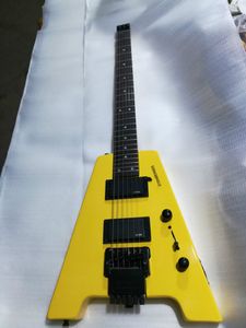 Gelbe, kopflose E-Gitarre mit massivem Korpus von Custom Shop, EMG-Tonabnehmer imitiert, Tremolo-Brücke, schwarze Hardware, Griffbrett aus Palisander, Dot-Inlay