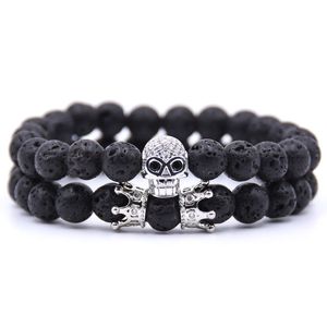 Neueste ausgefallene Herren- und Damen-Perlenstränge-Armbänder, schwarz/weiß vergoldete Legierung mit Totenkopf-Charm-Armbändern, 2 Stück/Set