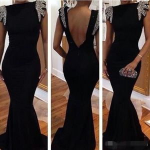 Designer Black Evening Dresses Crystal Beaded Capped Sleeves Ruffles Mermaid Sheath Sweep Train Backless Formal Prom Party Gown
