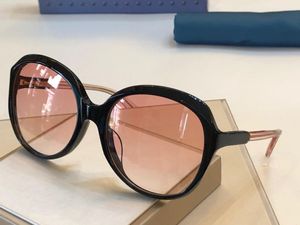 Luxury-New Fashion Designer Solglasögon 0489 Rundram Kvinnor Populär stil Toppkvalitet Kvinnor UV400 Skyddsglasögon med låda