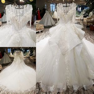 2019 Nyaste lyxiga bröllopsklänningar O Neck Swarovski Kristaller Pärlor Baklösa En Linje Lomg Tåg Lace Bling Anpassad Princess Bridal Gowns