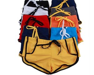 Partihandel sommar mode varumärke män sexiga bulging påse nitar mini boxare badkläder gay gym swim trunks beach board shorts