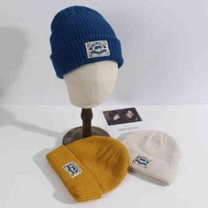 knit shops toptan satış-Hakiki Xiongbiao Yün Şapka Mağazası Basit Tasarım Yapıştır Bez Örme Erkekler Ve Kadın Net Kırmızı Sonbahar Kış
