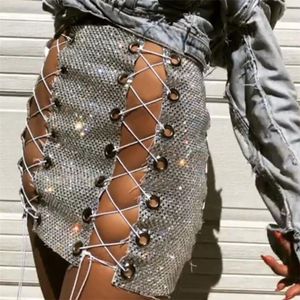 Wholesale rave skirt for sale - Group buy Skirts Shinny Mesh Metal Crystal Skirt Women Hollow Out Bandage Bodycon Mini Short Night Club Show Rave Festival