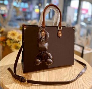 ingrosso cani per borsellini-Fashion Designer OnThego Shopping Bags con ciondolo cane crossbody book borse borse in rilievo di alta qualità donne tote borse borse