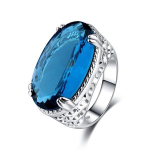 anéis de noivado azul claro venda por atacado-Oval luz azul grande gema anel de prata de casamento para mulheres micro embutidos simulação festa jóias anéis de banda de noivado