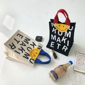 gülümseme çantası siyah toptan satış-Eğlence Anne Alışveriş Çanta Tuval Kadın Sonbahar Baskı Gülen Yüz Taşınabilir Çanta Siyah Krem Beyaz Çifte Kılıfı Pazarı Süpermarket Hediyeler Tote Çanta