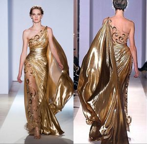 セクシーなワンショルダーゴールドのページェントプロムのガウンZuhair Murad Houte Coutureアップリケ光沢のある長いイブニングドレス