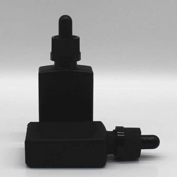 Le compte-gouttes de pipette de réactif liquide en verre dépoli noir de 30 ml met en bouteille la bouteille carrée de parfum d'huile essentielle