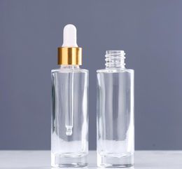 Flacons compte-gouttes en verre transparent de 30 ml Bouteille de parfum d'huile essentielle d'épaule plate à paroi épaisse de 1 oz avec capuchon supérieur doré SN5246