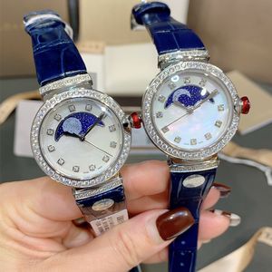 Reloj de diamantes de 33 * 11 mm Sol, luna y estrellas importados Movimiento de cuarzo Espejo de zafiro Perla Esfera de nácar Relojes de pulsera para mujer de piel de vaca importada