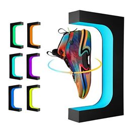 Support d'affichage à chaussures rotatifs à 360 degrés avec lumières LED colorées.