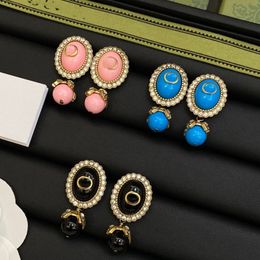 4 gekleurde mode parel hanger bedel oorbellen roze dames retro goud letter in elkaar grijpende oorknopjes ontwerper sieraden G oorbellen met doos