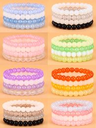4 pulseras curativas de cuerda elástica con cuentas de colores.
