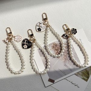 4 estilos llaveros de cadena de perlas chica mujer bolso colgante decoración llavero accesorios de moda al por mayor