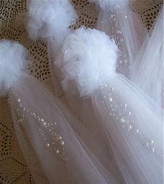 4pcs Pom Pew Bows Tulle and Pearl Bows Church Pew Pew Bows Quinceanera Decoraciones Sillas Decoración de bodas Bridal 220215244999102