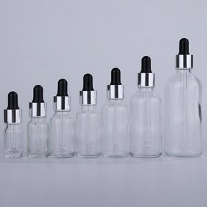 Frascos cuentagotas de vidrio transparente vacíos de 5-100 ml al por mayor con tapa plateada Tapa de goma negra para cuentagotas Aromaterapia Botellas de esencia gruesa Plkd