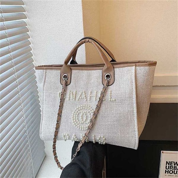 50% de descuento en la venta de liquidación 2023 Nuevo bolso de mano estilo pequeño y fresco para mujer Bolso de mano con letras decorativas y cuentas de perlas Modelo ins 258