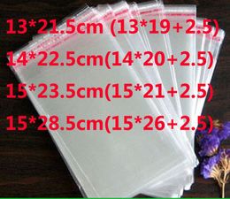 500pcs / lot auto-adhésif joint poly sac opp emballage sacs d'emballage en plastique transparent 15x23.5cm 15x28.5cm 13x21.5cm 14x22.5cm