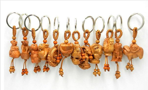 500 Uds piezas de bolsa estilo chino 3D tallado en madera ilustraciones zodiaco chino llavero con dijes mochila de moda colgante de cadena