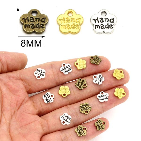 50pcs Flores de ciruela Etiquetas de metal para joyas Etiquetas hechas de mano de bronce plateado 8*8 mm hechos a mano para sombrero/bolsas Accesorios de prendas