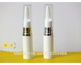 Stylo crème pour les yeux 5ML avec tête de massage frottis bouteille blanche pompe en argent doré couvercle transparent, 50 pièces