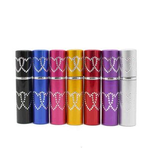 Bouteilles d'atomiseur de parfum en aluminium rechargeables de 5 ml Conteneur de liquide portable Cosmétiques Mini Double Heart Spray Alcochol Bouteille vide Travelingv Yythe