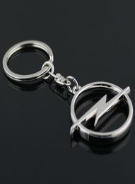 5PCSLOT Fashion Metal 3d Car Logo Keychain Keychain Chain Keyring Key Ring Chaveiro Llavero pour Opel Auto Pendant Car Accessoires Whol8518957