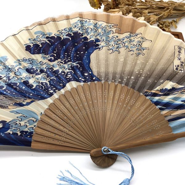 

japanese style handheld folding fan sunset over mount fuji with traditional japanese prints of great wave off kanagawa
