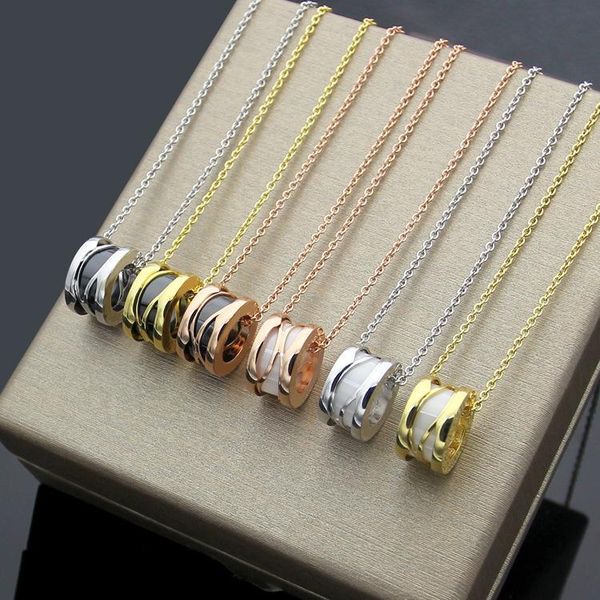 

2020 designer new b-letter labyrinth hollowed out ceramic necklace black and white ceramic couple necklace with ripple pattern