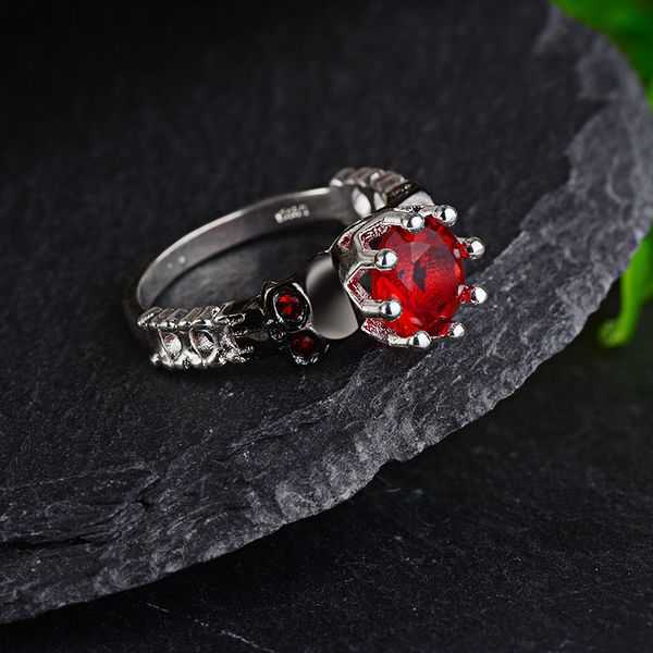 

personality non main stream bone hand decorate human skeleton head punk red steel yu nv quality ring, Silver