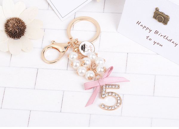 

new creative swan number 5 pendant pearl bow car keychain beauty head small gift pendant, Black
