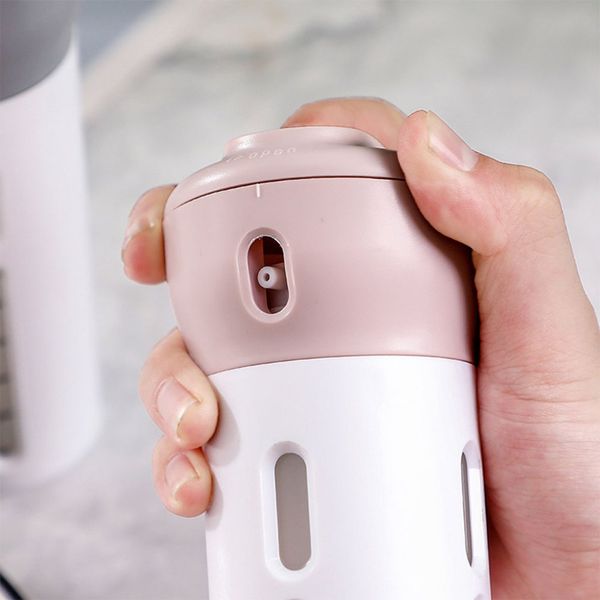 

beautiful shape safe material travel lotion bottled business travel cosmetic bottle portable four-in-one rotary press