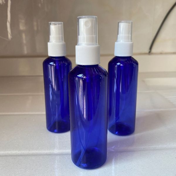 

100ml blue fine mist spray bottle with white pump round shoulder portable rubbing alcohol bottle