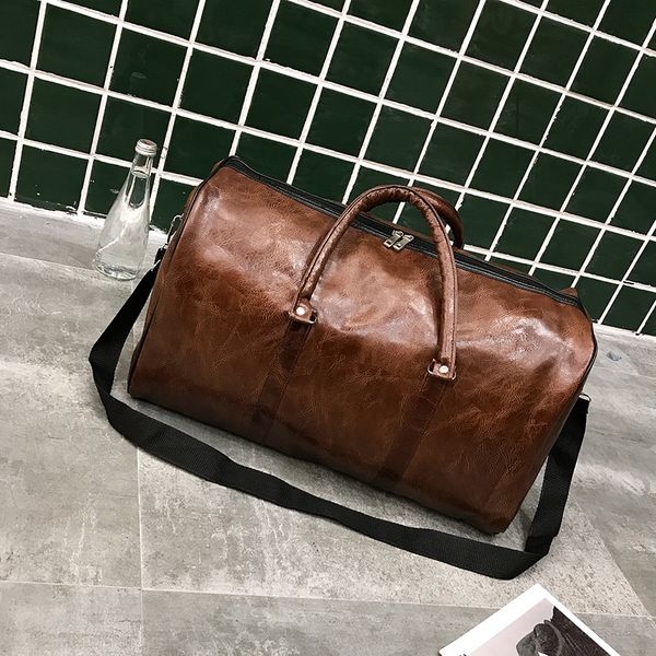 

outdoor bags 2021 fashion portable ladies travel bag pu large capacity waterproof short-distance luggage men sports and fitness handbag