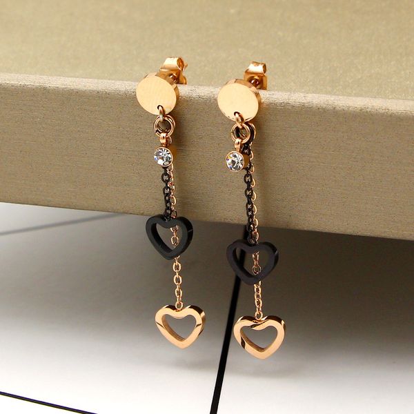 

2019 new fashion stone bracket between black tassel double heart rose gold stud fashionable titanium steel plated color gold stud, Golden;silver