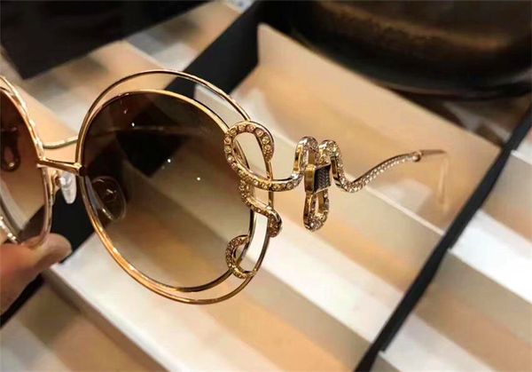 

Luxury cla ic fa hion de igner ungla e 1024 retro round metal frame nake mirror leg with mall diamond popular tyle uv