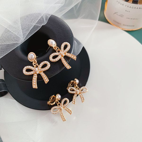 

korean elegant bowknot simulated pearl earrings for women girls gold color metal hollow out big statement drop earrings jewelry, Silver