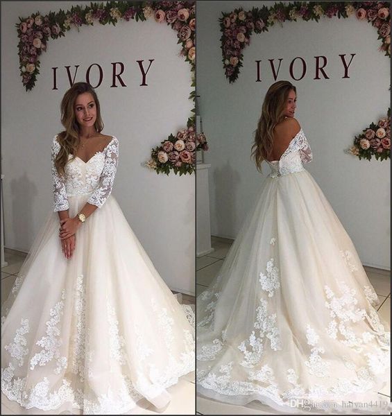 Abiti da sposa linea A con spalle scoperte maniche lunghe a tre quarti Applicazioni in pizzo con scollo a V trasparente sul retro Abiti da sposa taglie forti