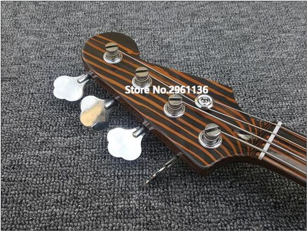 

electric bass guitar,zebra wood bass guitar,transparent guard,ing