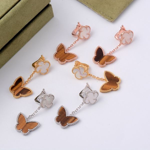 

Дизайнер бренд Женщина Мужчины Белого Four Leaf Clover Tiger Eye Brown Бабочка Цветок золото ух