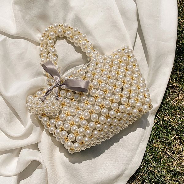 

elegant female pearl tote bag 2020 summer fashion new women's handbag rivet hand bag small travel