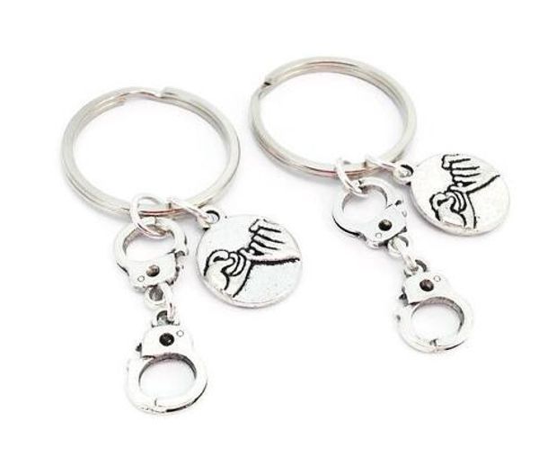 

2019 новый древний серебряный преступный банды наручники кулон рука в сестрах брелок брелок европа сша популярные горячие продажа ювелирных, Slivery;golden