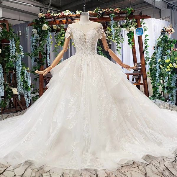 

2019 latest bohemian wedding dresses open keyhole lace up back tulle short sleeve illusion o neck lace applique pattern sequins bridal gowns, White