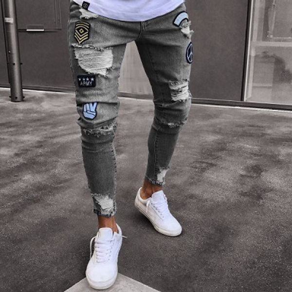 Jeans con ricamo distintivo da uomo Pantaloni jeans skinny con cerniera con foro al ginocchio di nuova moda per pantaloni in denim maschile da taglia Meen dalla S alla 3XL