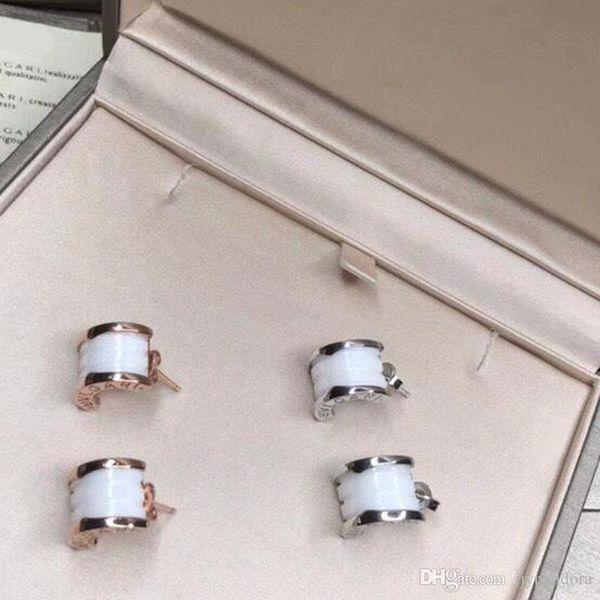 

2019 brand designer brand ladies elegant personality black and white ceramic earrings titanium steel cross 18k quality ing, Silver