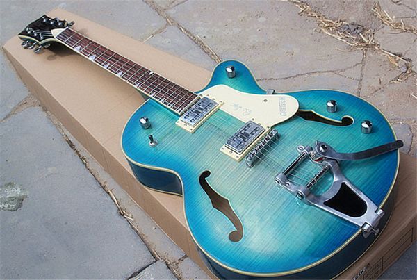 

jazz semi-hollow double f hole light blue electric guitar hh pickups,bigby bridge and chrome hardwares,special fret,rosewood fretboard.