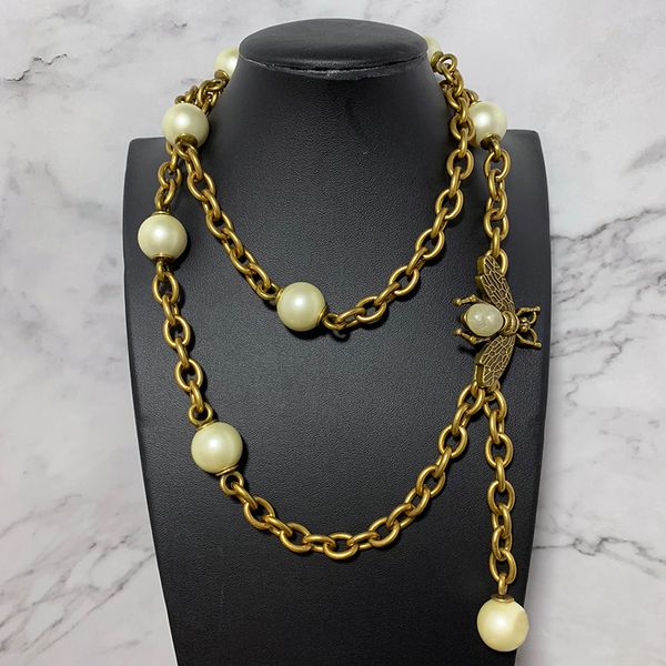 

марка модные ювелирные изделия для женщин свитер цепной пояс старинные жемчужные кулон партия старинные пчела жемчужное ожерелье желтый лату, Silver